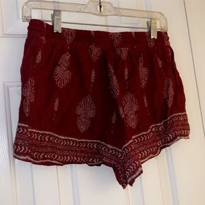 •Red flowy shorts•